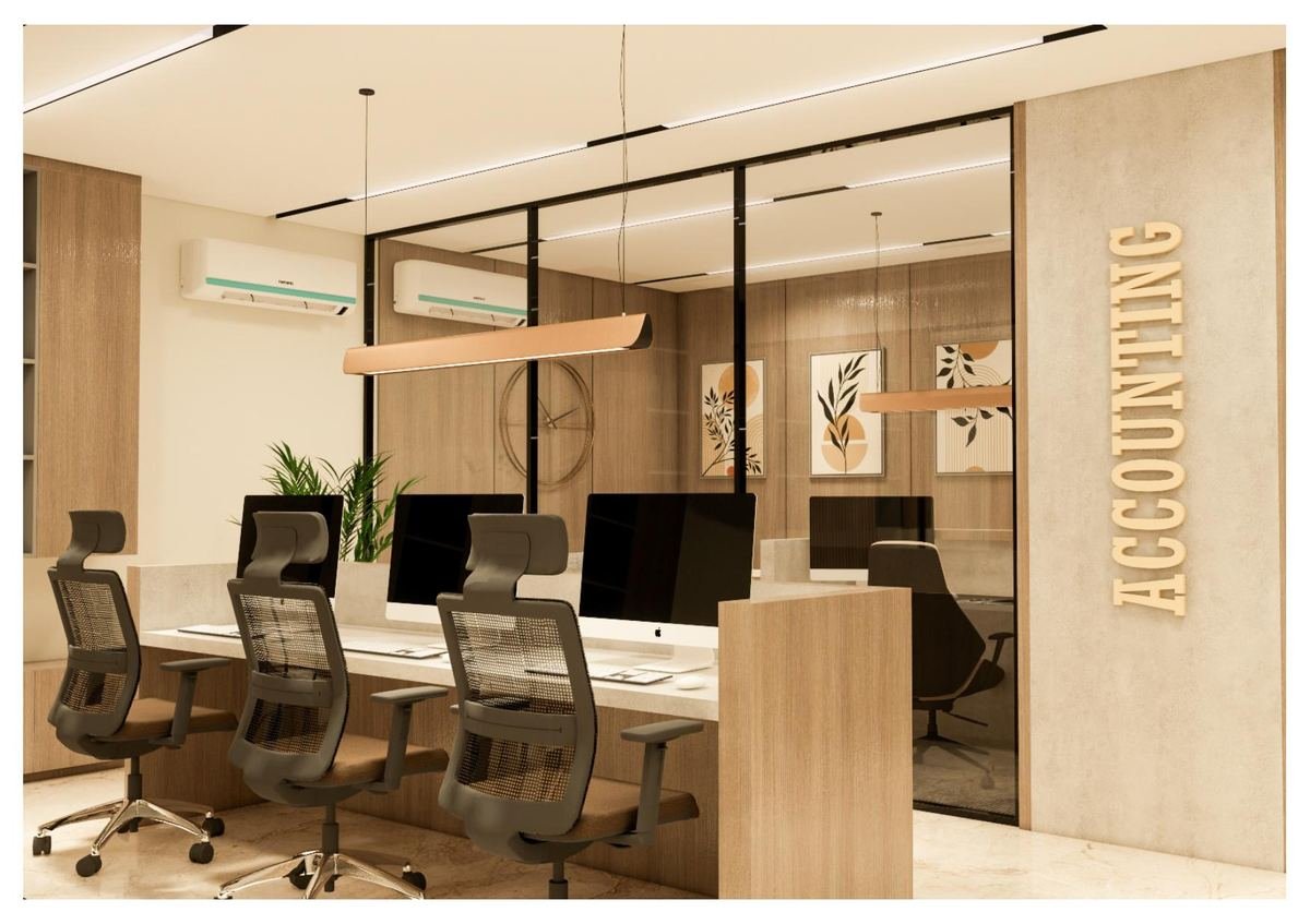 Open-plan accounting office desks behind glass partition