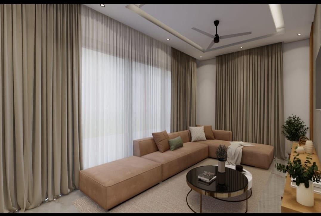 Living room interior with beige sectional sofa and layered curtains